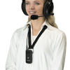 Young smiling woman with an over-the-ear headphone set with a boom microphone that is plugged into a ListenTALK receiver